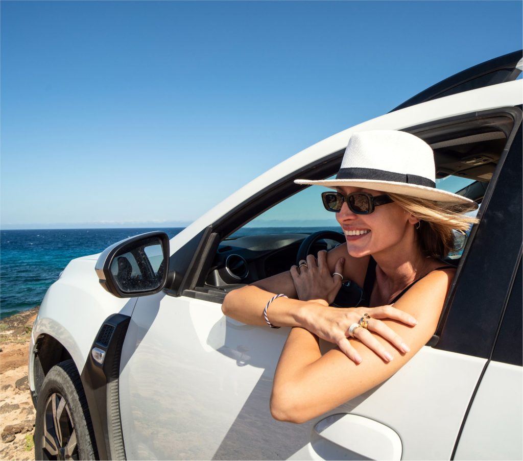 Easy Cars Corfu Car Rentals happy girl looking at the view from her car